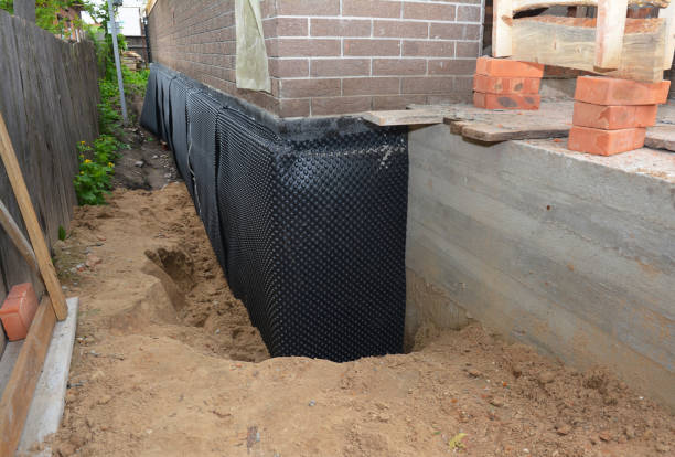Happy homeowners after waterproofing job in Piketon